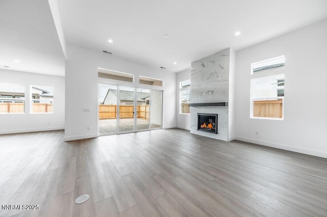 7511 Hoback Dr Unit Windsong 54, Sparks, NV 89436 - unfurnished living room with wood finished floors, a fireplace, and recessed lighting
