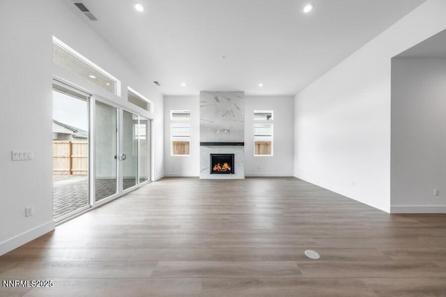 7511 Hoback Dr Unit Windsong 54, Sparks, NV 89436 - unfurnished living room with recessed lighting, wood finished floors, and a high end fireplace