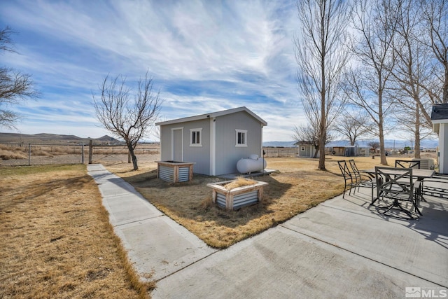 605 E US Highway 95a, Yerington, NV 89447 - view of side of home with an outbuilding, outdoor dining area, and a patio