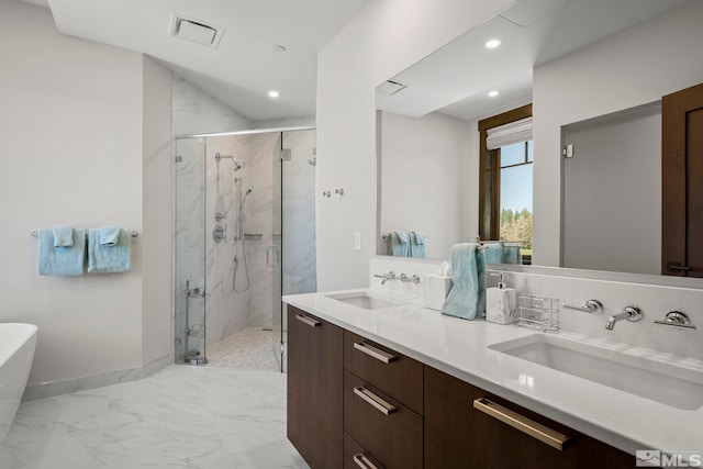 28 Beach Club Dr Unit 407, Stateline, NV 89449 - bathroom with marble look tiles, a marble finish shower, a freestanding tub, recessed lighting, and double vanity