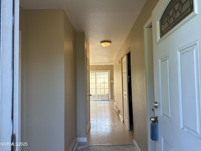 474 Smithridge Pkwy, Reno, NV 89502 - hallway with baseboards, baseboard heating, a textured ceiling, and a baseboard radiator
