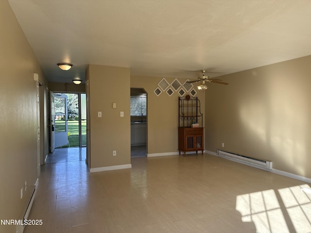 474 Smithridge Pkwy, Reno, NV 89502 - spare room featuring a baseboard radiator, baseboards, ceiling fan, baseboard heating, and a sink
