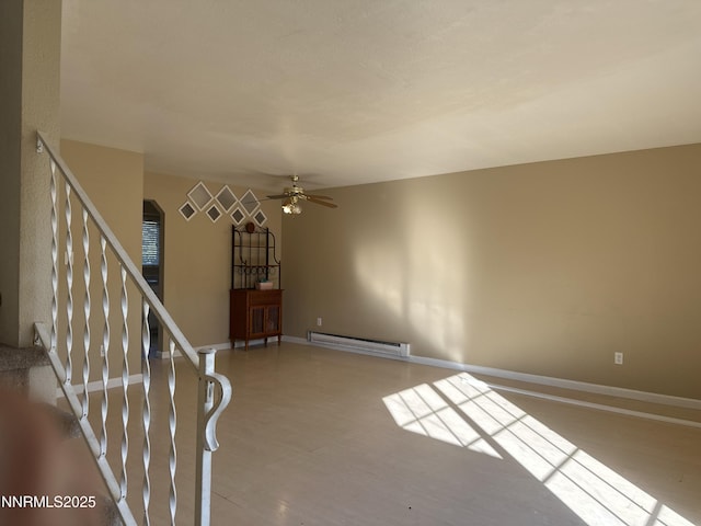 474 Smithridge Pkwy, Reno, NV 89502 - spare room featuring a baseboard radiator, ceiling fan, baseboards, stairway, and wood finished floors
