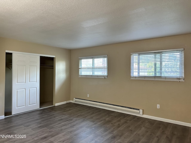 474 Smithridge Pkwy, Reno, NV 89502 - unfurnished bedroom featuring a baseboard radiator, dark wood-style floors, a closet, baseboards, and a textured ceiling