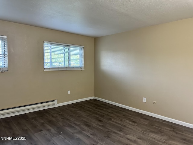 474 Smithridge Pkwy, Reno, NV 89502 - unfurnished room with dark wood-type flooring, baseboard heating, baseboards, and a textured ceiling