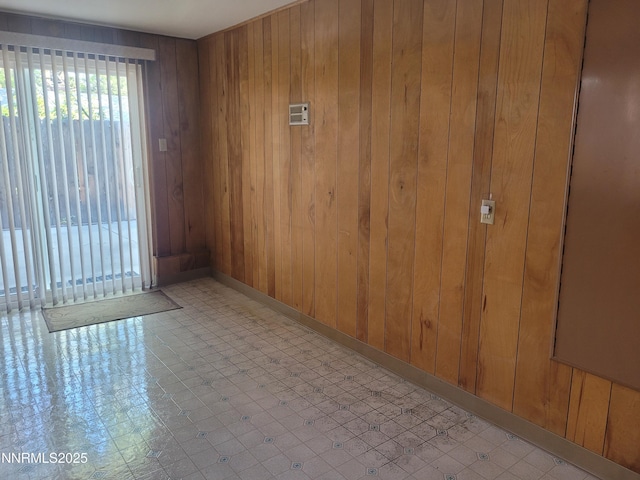 421 Glenmanor Dr, Reno, NV 89509 - unfurnished room featuring light floors, wooden walls, and baseboards