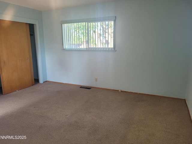 421 Glenmanor Dr, Reno, NV 89509 - unfurnished bedroom with carpet floors, baseboards, and a closet