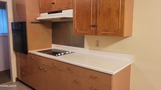 421 Glenmanor Dr, Reno, NV 89509 - kitchen featuring under cabinet range hood, black appliances, light countertops, and brown cabinetry