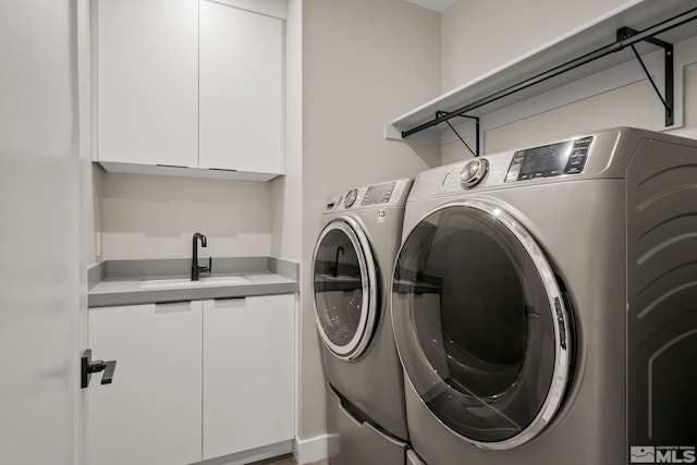 62 Caballada St, Reno, NV 89511 - clothes washing area with washer and dryer and cabinet space