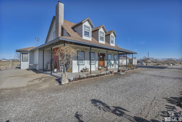 5650 S Allen Rd, Fallon, NV 89406 - view of front facade with a chimney and a porch