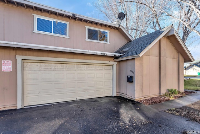 2267 Rock Blvd, Sparks, NV 89431 - garage featuring asphalt driveway