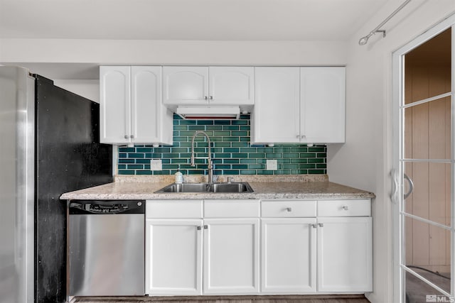 2267 Rock Blvd, Sparks, NV 89431 - kitchen with appliances with stainless steel finishes, a sink, white cabinets, and tasteful backsplash