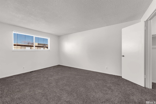 2267 Rock Blvd, Sparks, NV 89431 - spare room featuring dark colored carpet and a textured ceiling