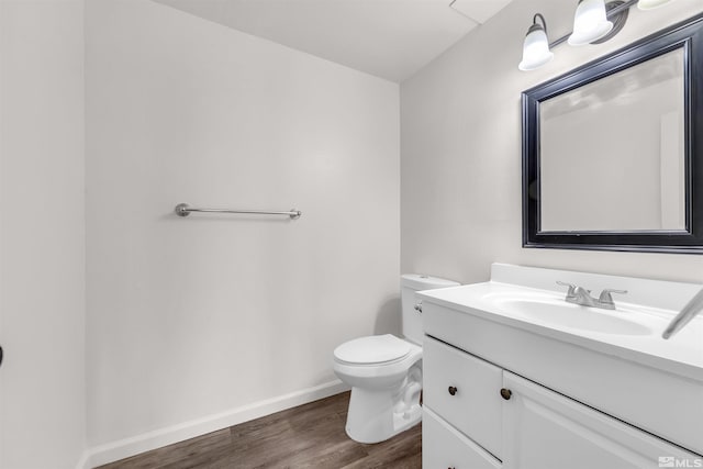 2267 Rock Blvd, Sparks, NV 89431 - bathroom featuring wood finished floors, vanity, toilet, and baseboards