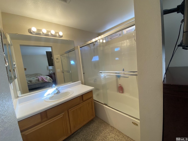 9770 Brightridge, Reno, NV 89506 - full bath featuring ensuite bathroom, vanity, shower / bath combination with glass door, and speckled floor