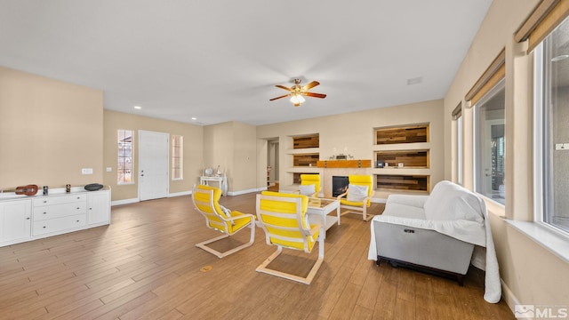 11725 Paradise View Dr, Sparks, NV 89441 - living area with a ceiling fan, light wood finished floors, baseboards, and recessed lighting