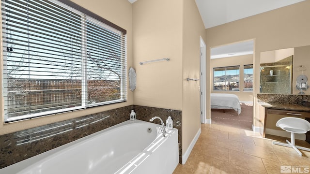 11725 Paradise View Dr, Sparks, NV 89441 - bathroom with a garden tub, ensuite bath, vanity, tile patterned flooring, and tiled shower