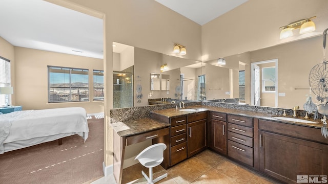 11725 Paradise View Dr, Sparks, NV 89441 - bathroom with tiled shower, double vanity, ensuite bath, and tile patterned floors