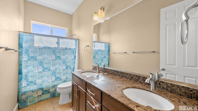 11725 Paradise View Dr, Sparks, NV 89441 - bathroom featuring toilet, double vanity, decorative backsplash, a shower with curtain, and tile patterned flooring