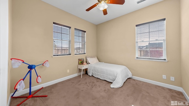 11725 Paradise View Dr, Sparks, NV 89441 - carpeted bedroom with baseboards and a ceiling fan
