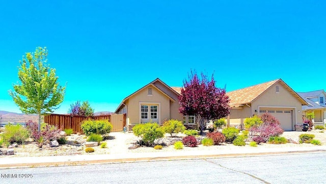 11725 Paradise View Dr, Sparks, NV 89441 - view of front of home featuring an attached garage and stucco siding