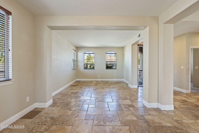 8389 Opal Ranch Way, Reno, NV 89506 - spare room featuring stone tile flooring and baseboards