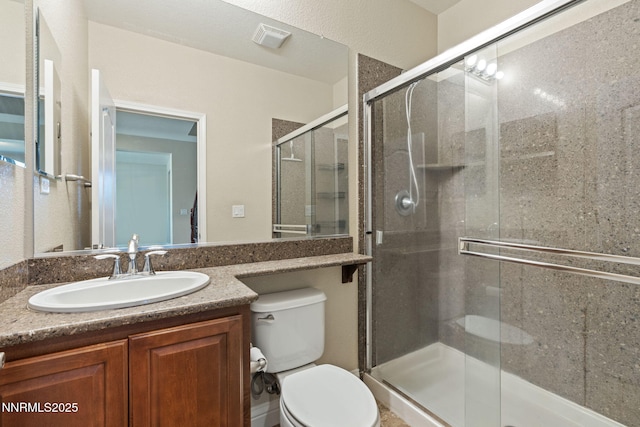 8389 Opal Ranch Way, Reno, NV 89506 - bathroom featuring toilet, vanity, and a stall shower