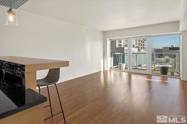255 N Sierra St Unit 606, Reno, NV 89501 - unfurnished living room with wood finished floors