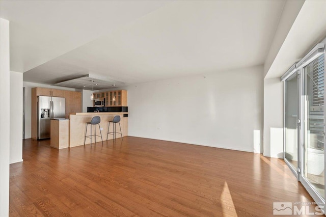 255 N Sierra St Unit 606, Reno, NV 89501 - unfurnished living room with wood finished floors