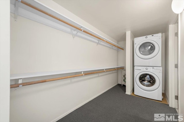 255 N Sierra St Unit 606, Reno, NV 89501 - washroom featuring estacked washer and dryer, carpet, and baseboards