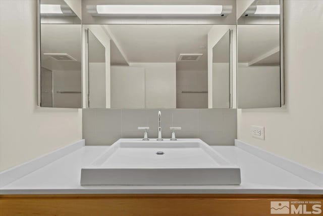 255 N Sierra St Unit 606, Reno, NV 89501 - bathroom with backsplash and vanity