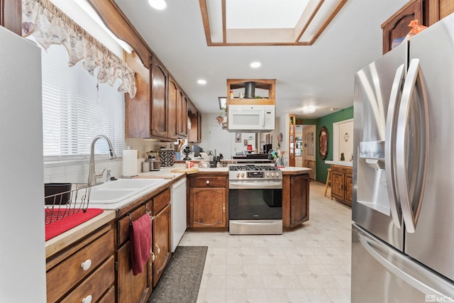 1000 Mountain, Carson City, NV 89703 - kitchen with appliances with stainless steel finishes, a sink, light countertops, recessed lighting, and brown cabinets