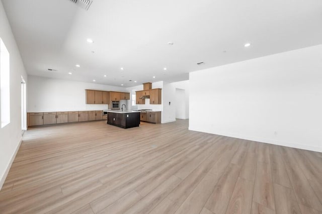 401 Pah Rah Ridge Dr Unit Harris 35, Sparks, NV 89441 - unfurnished living room featuring recessed lighting, light wood-style floors, a sink, and baseboards