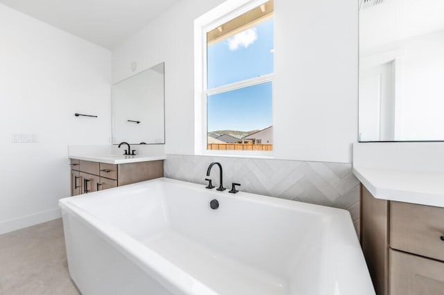 401 Pah Rah Ridge Dr Unit Harris 35, Sparks, NV 89441 - full bathroom featuring vanity, a freestanding tub, and tile patterned flooring
