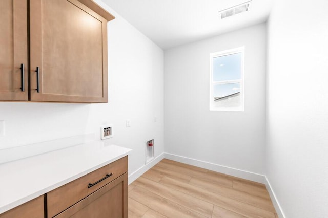 401 Pah Rah Ridge Dr Unit Harris 35, Sparks, NV 89441 - laundry room featuring washer hookup, cabinet space, light wood-style floors, baseboards, and hookup for an electric dryer