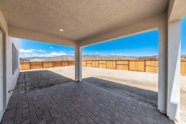 401 Pah Rah Ridge Dr Unit Harris 35, Sparks, NV 89441 - view of patio / terrace featuring a mountain view and a fenced backyard
