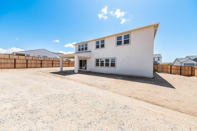401 Pah Rah Ridge Dr Unit Harris 35, Sparks, NV 89441 - rear view of house with a fenced backyard and a patio
