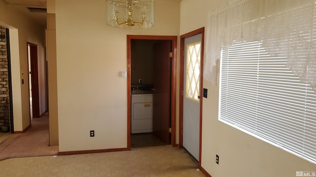 223 I St, Hawthorne, NV 89415 - corridor with washer / clothes dryer, light carpet, a chandelier, and baseboards
