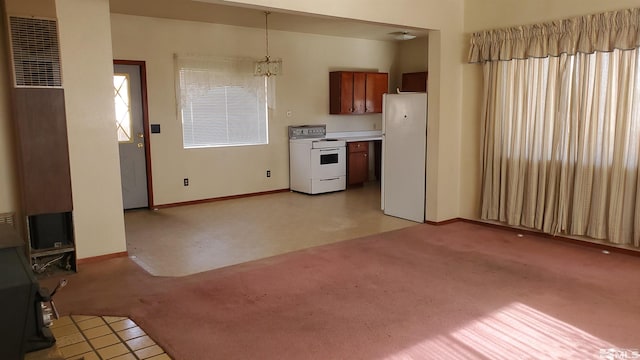 223 I St, Hawthorne, NV 89415 - kitchen with white appliances, light carpet, and baseboards