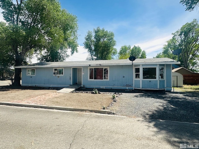 815 16th St, Lovelock, NV 89419 - manufactured / mobile home featuring a storage shed and an outdoor structure