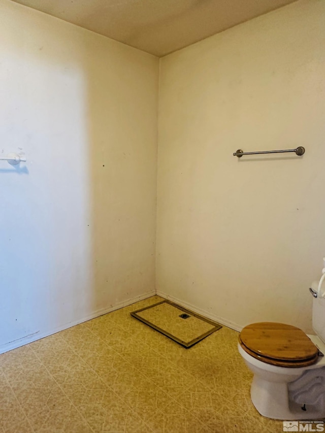 815 16th St, Lovelock, NV 89419 - bathroom featuring toilet and tile patterned floors