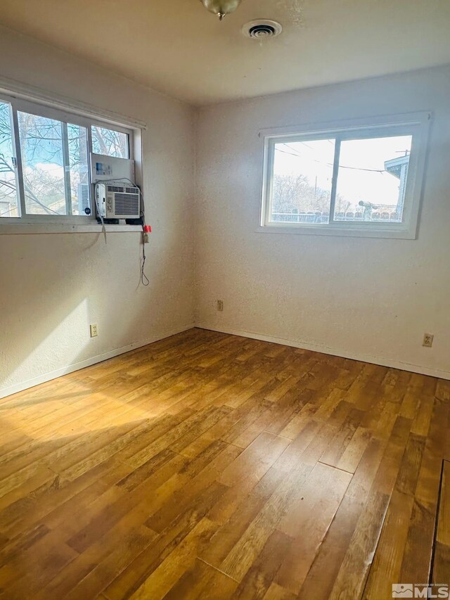 815 16th St, Lovelock, NV 89419 - unfurnished room with wood-type flooring, healthy amount of natural light, and baseboards