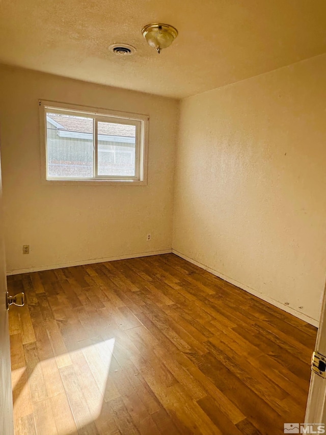 815 16th St, Lovelock, NV 89419 - unfurnished room with dark wood-type flooring