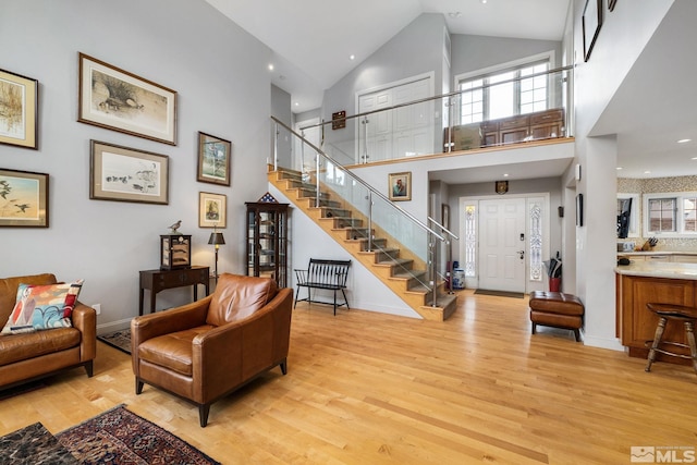 6350 Green Ranch Rd, Reno, NV 89519 - living room featuring light wood-type flooring, stairs, high vaulted ceiling, baseboards, and recessed lighting