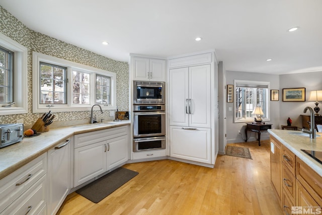 6350 Green Ranch Rd, Reno, NV 89519 - kitchen featuring a sink, stainless steel appliances, light wood-style flooring, and recessed lighting
