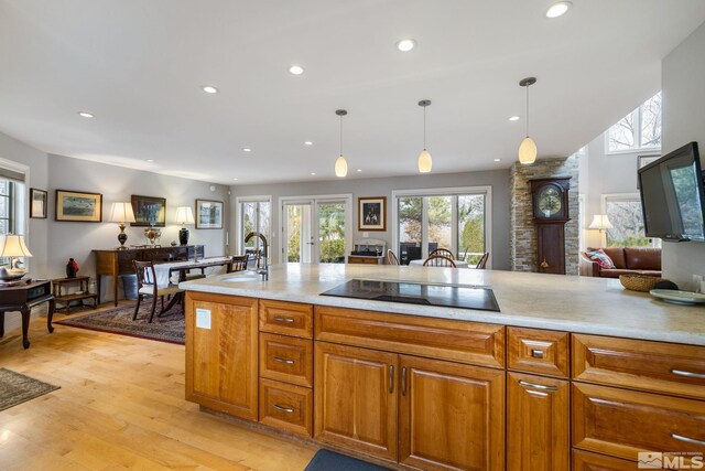 6350 Green Ranch Rd, Reno, NV 89519 - kitchen featuring black electric cooktop, a sink, recessed lighting, light countertops, and light wood-style floors