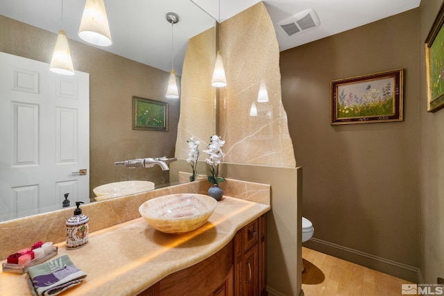 6350 Green Ranch Rd, Reno, NV 89519 - bathroom featuring vanity, toilet, wood finished floors, and baseboards
