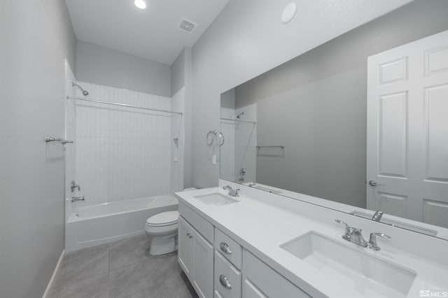 bathroom featuring toilet,  shower combination, double vanity, tile patterned flooring, and baseboards