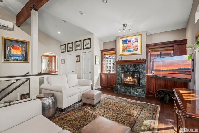 400 Fairview Blvd Unit 155, Incline Village, NV 89451 - living room with hardwood / wood-style floors, a fireplace, a wall mounted AC, arched walkways, and recessed lighting