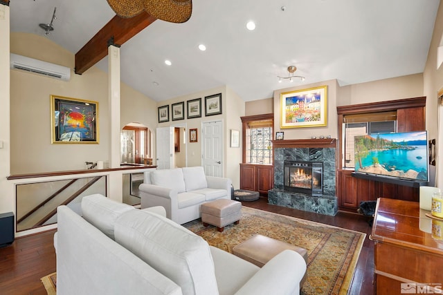 400 Fairview Blvd Unit 155, Incline Village, NV 89451 - living room featuring an AC wall unit, arched walkways, dark wood-type flooring, a fireplace, and recessed lighting